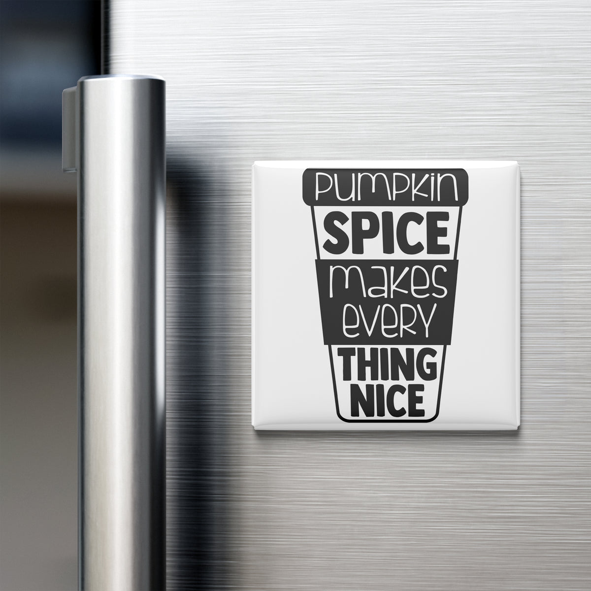a white magnet with a black text design on a metallic surface, which reads "Pumpkin spice makes every thing nice".