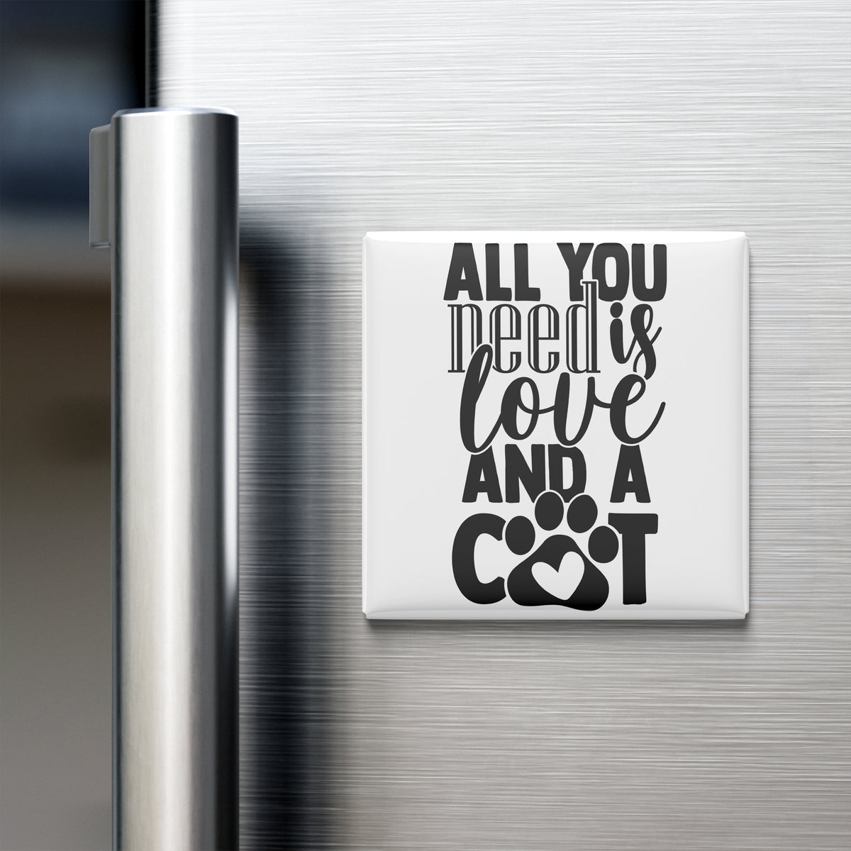 A white refrigerator magnet with the text "ALL YOU NEED IS LOVE AND A COOT" printed on it.