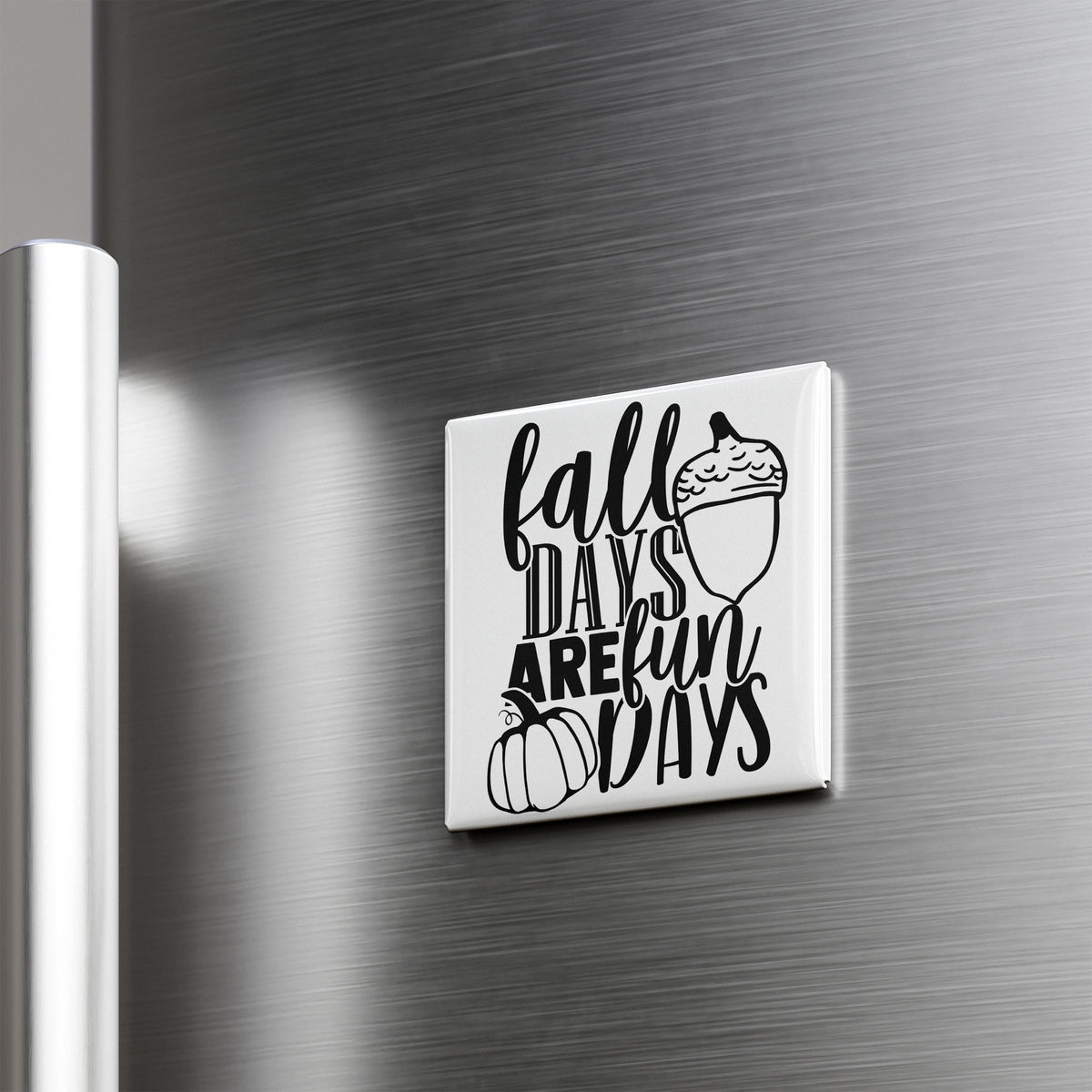 A white refrigerator door with a black and white graphic and text that says "fall days are fun days".