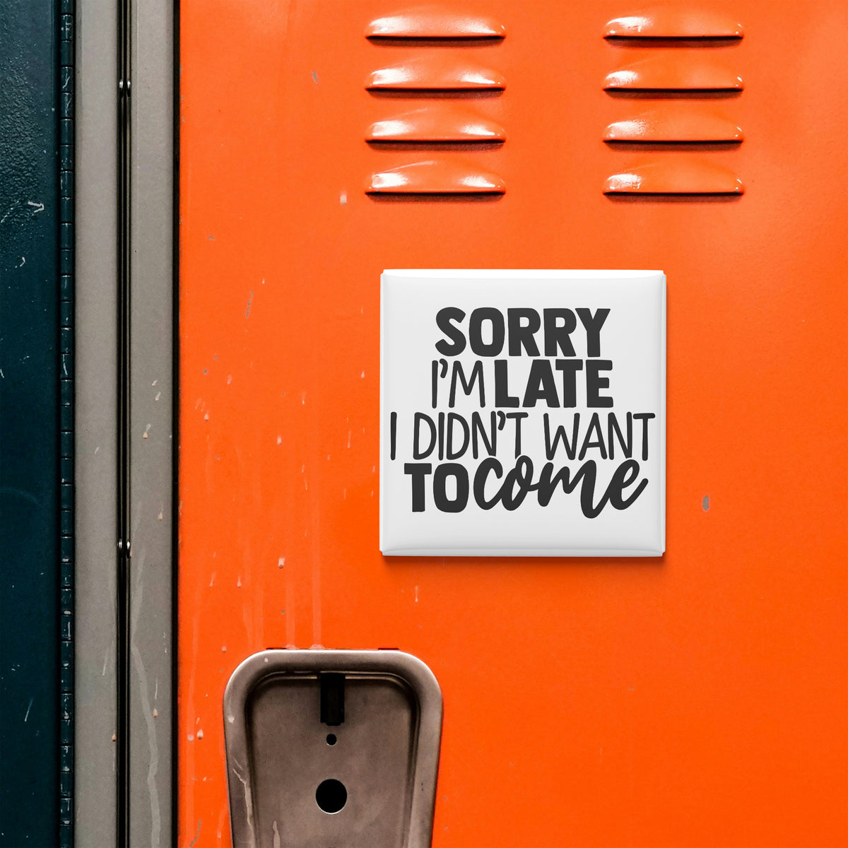 a sign with the text "Sorry I'm Late I Didn't Want To Come" on an orange surface, which appears to be a locker or a storage unit.
