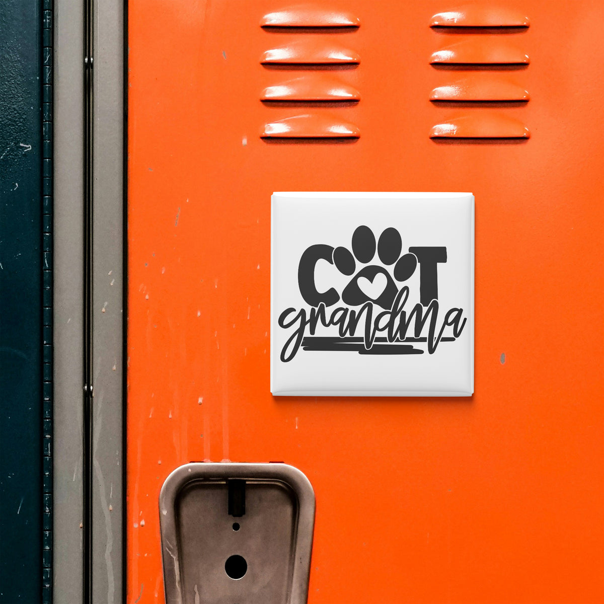 a close-up of an orange locker with a sign that says "COT grandmother" attached to it.