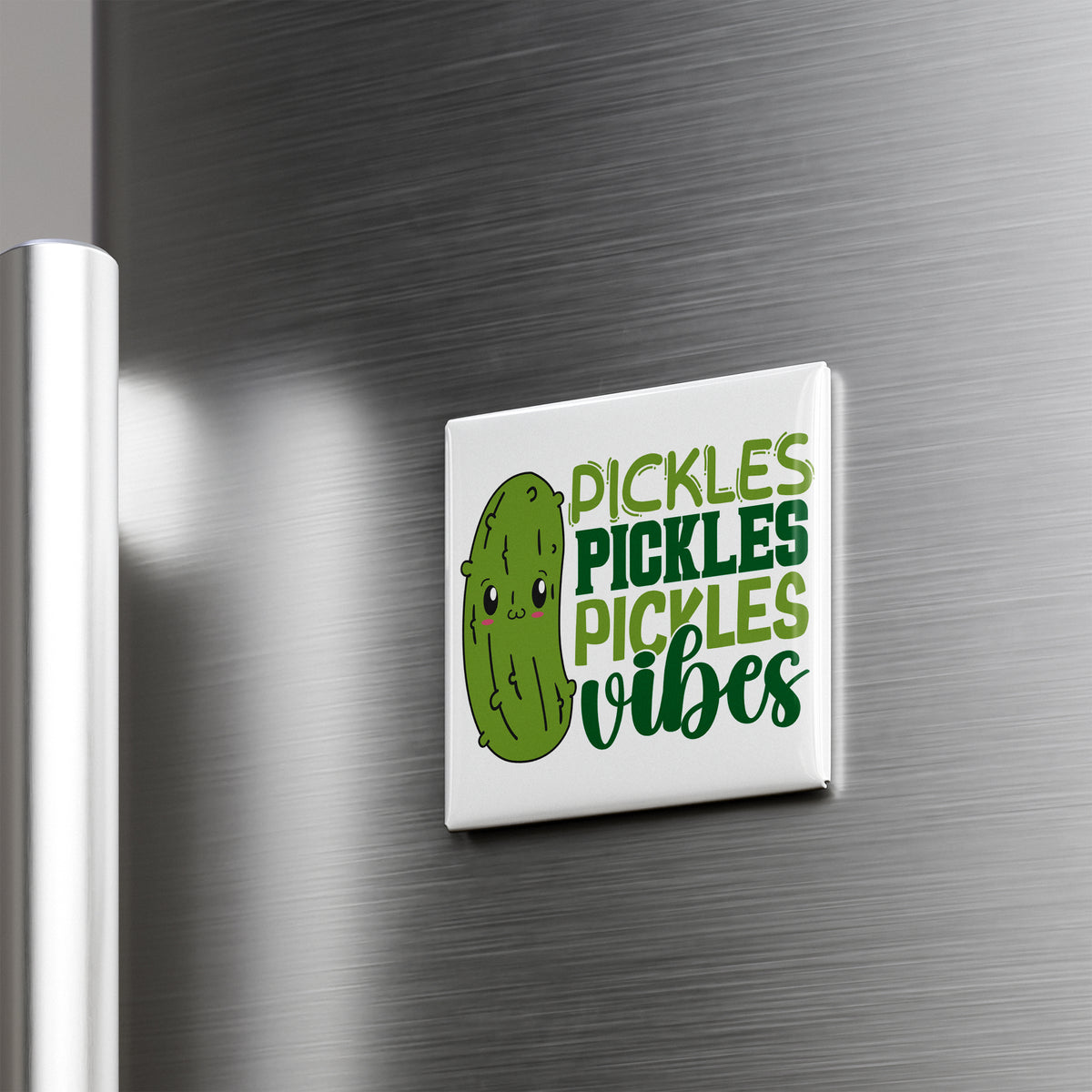 A refrigerator magnet with a cartoon pickle and the text "Pickles, Pickles, Vibes" written on it.