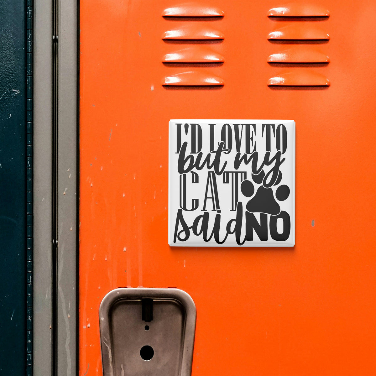 a sticker with the text "I'd love to but my cat said no" on an orange surface, which appears to be a locker or a similar storage unit.
