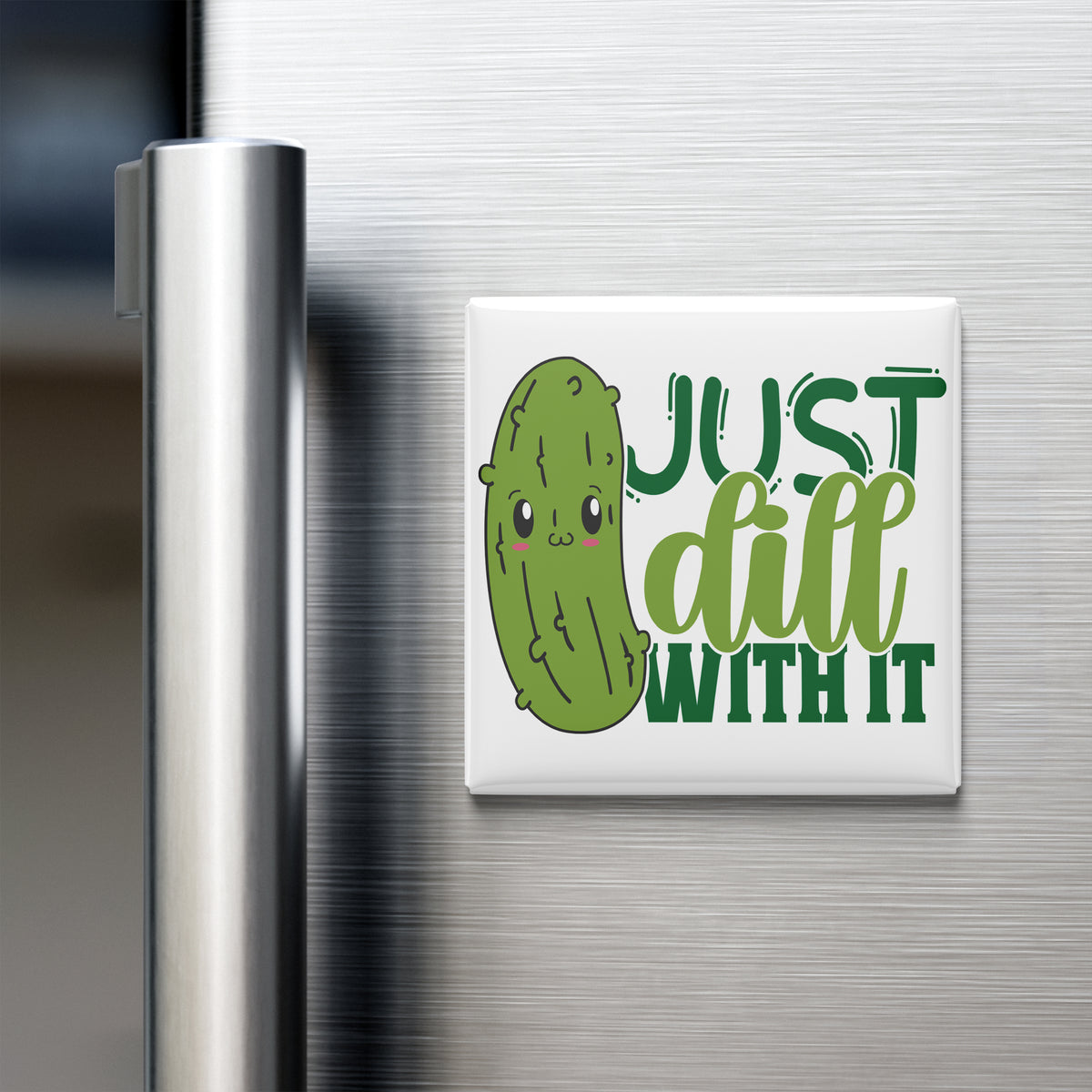 A refrigerator magnet with a cartoon pickle and the text "Just dill with it" on it.
