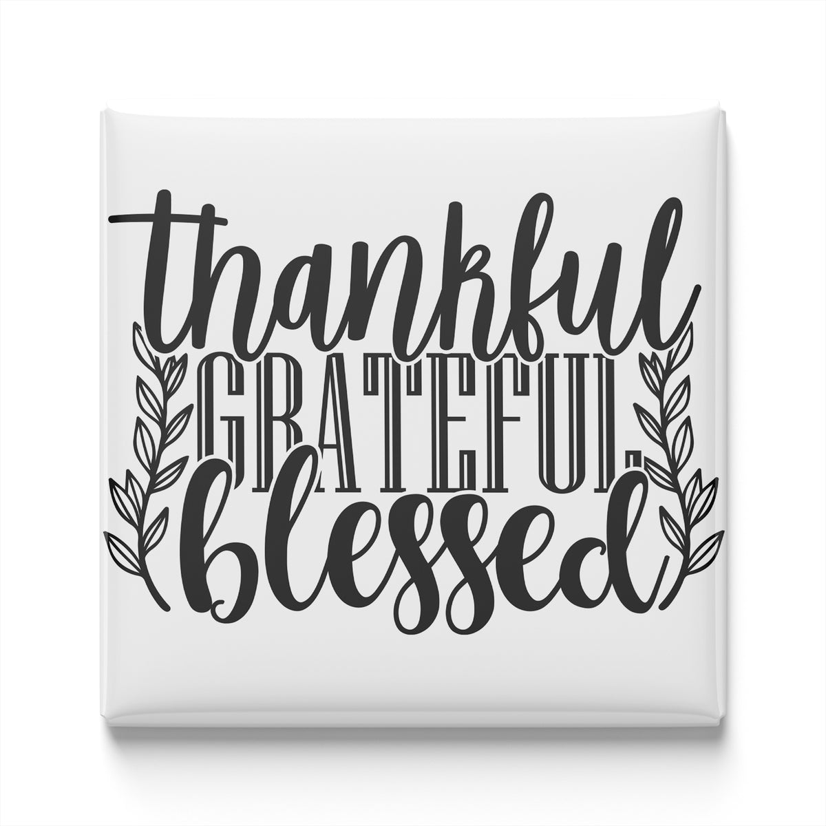 the text "Thankful, Grateful, Blessed" in a stylized font, surrounded by decorative leaves.