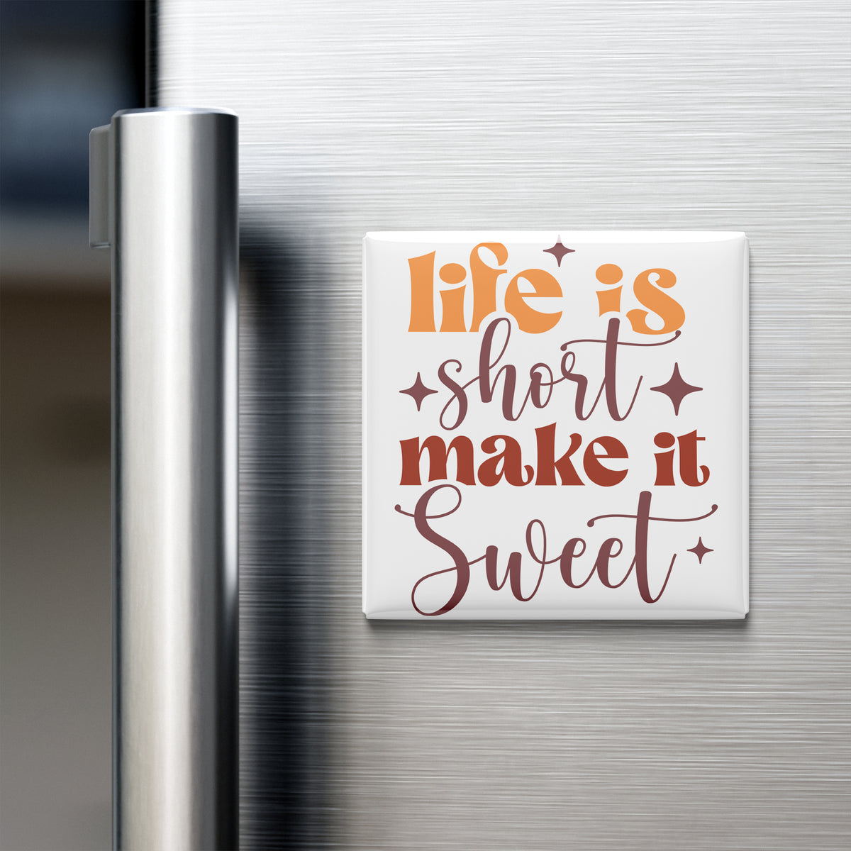 a refrigerator with a white magnet that says "Life is short, make it sweet" in a stylized font.