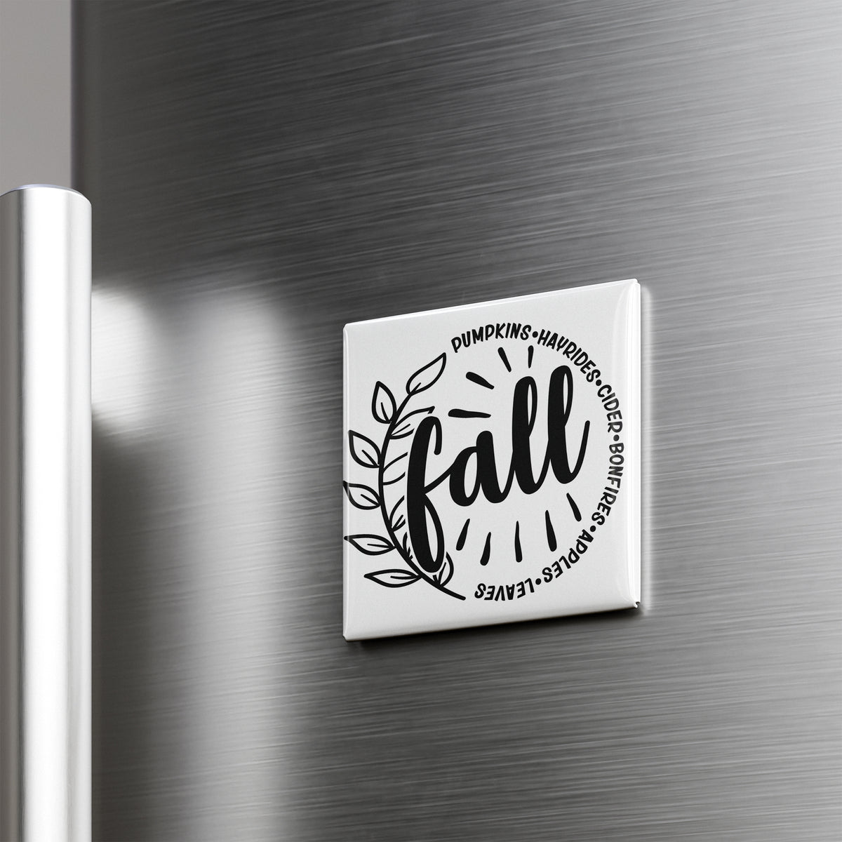 A white refrigerator magnet with the word "fall" written on it.