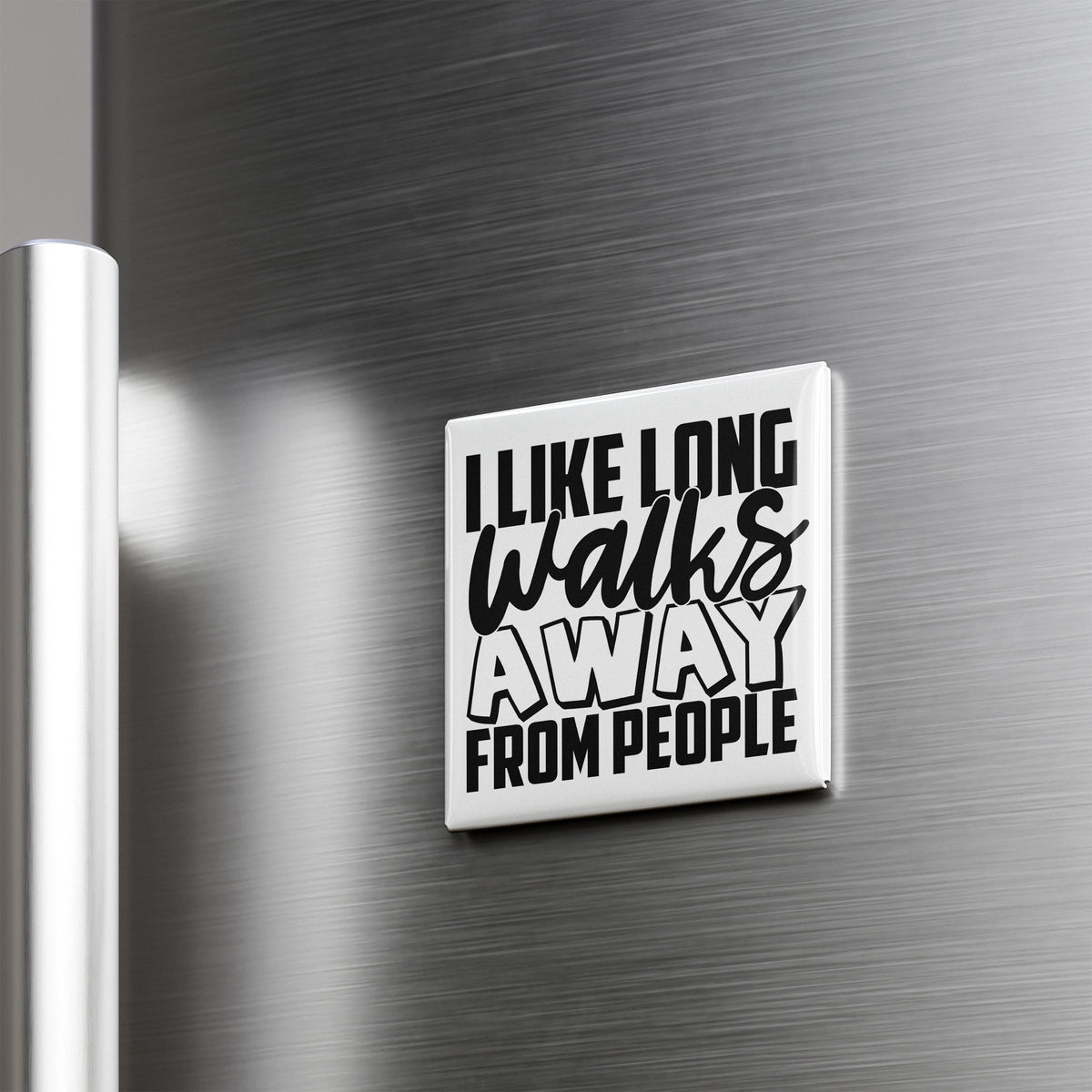 a white square magnet with the text "I LIKE LONG WALKS AWAY FROM PEOPLE" on it.