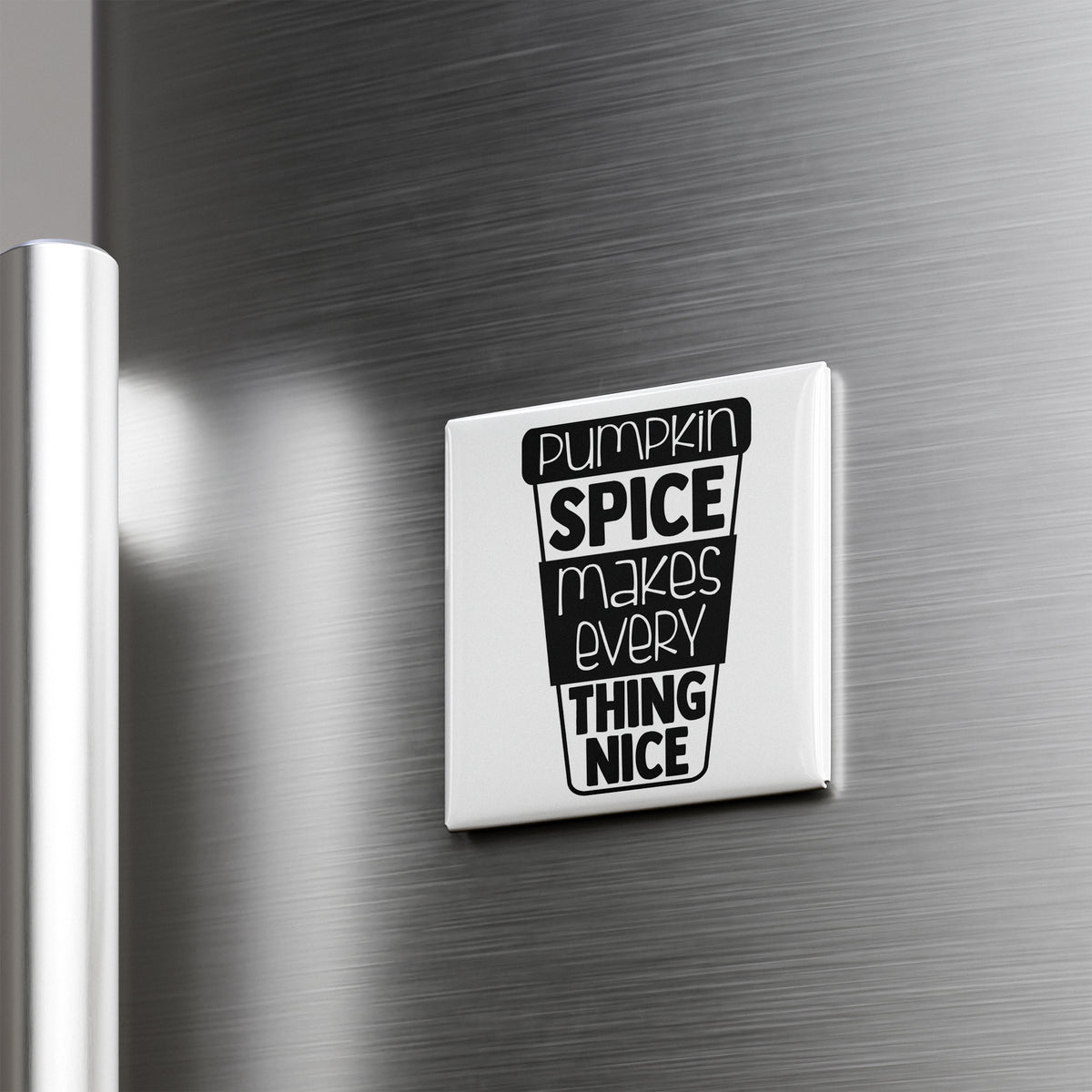 A white refrigerator magnet with the text "Pumpkin spice makes everything thing nice" printed on it.