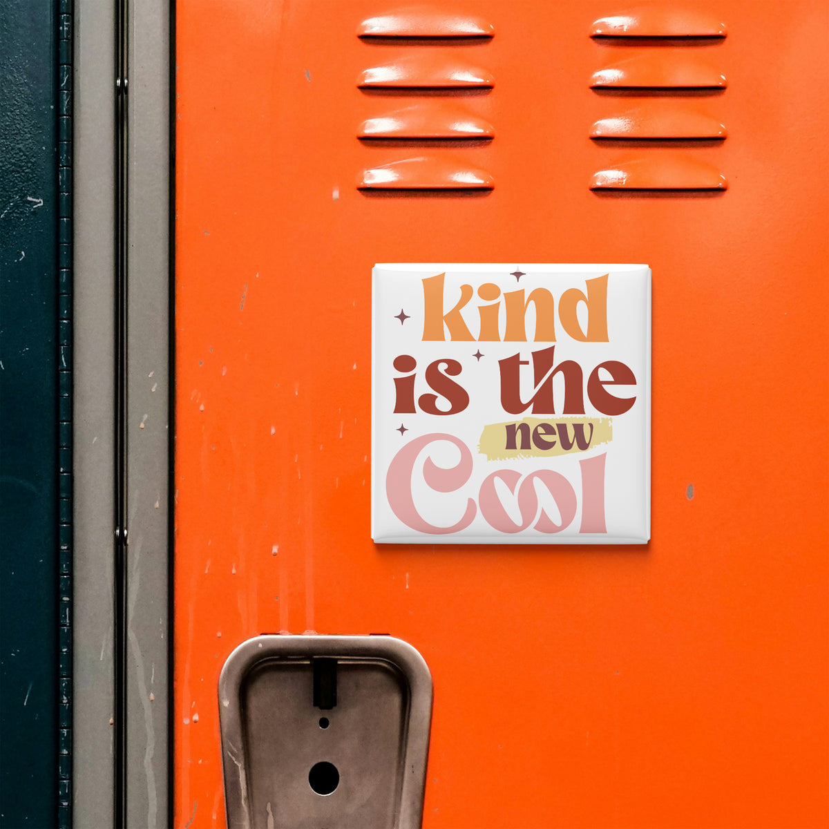 a vibrant orange wall with a motivational quote in the center, which reads "kind is the new cool".