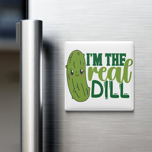 A refrigerator door with a magnet that says "I'm the real dill" in a playful, cartoonish font.