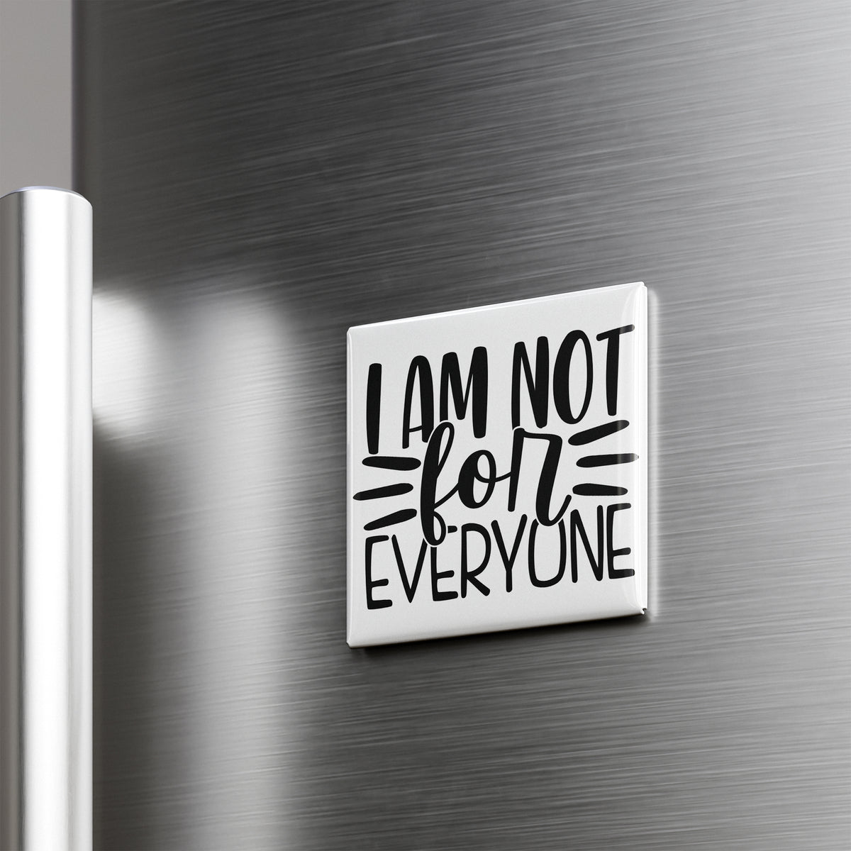 A white magnet with the text "I AM NOT FOR EVERYONE" on it is attached to a metallic surface.