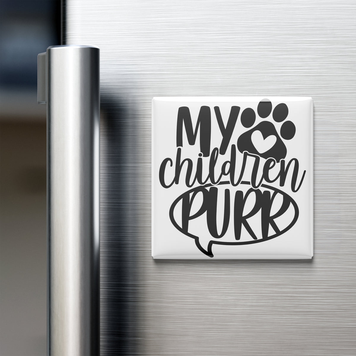A white refrigerator magnet with the text "MY CHILDREN PURR" and a paw print graphic.