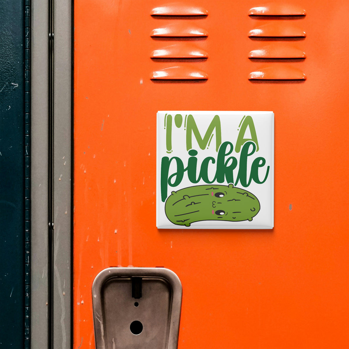 a sticker with a cartoon pickle on an orange surface.