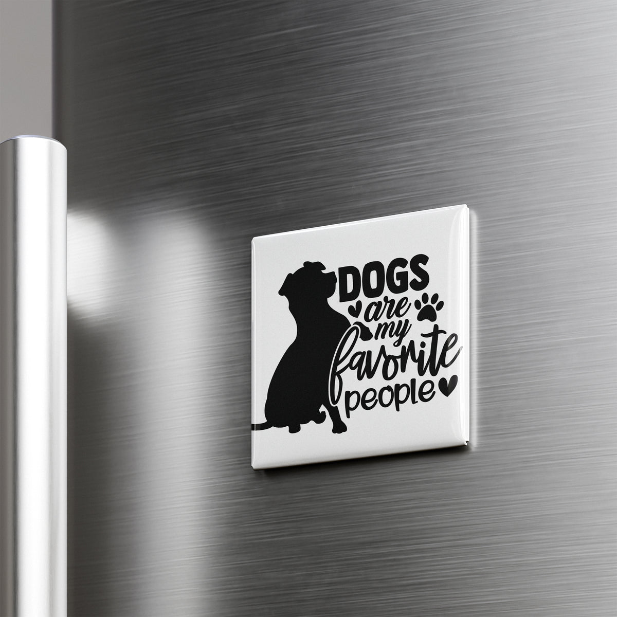 A magnet with the text "Dogs are my favorite people" on it, featuring a silhouette of a dog.