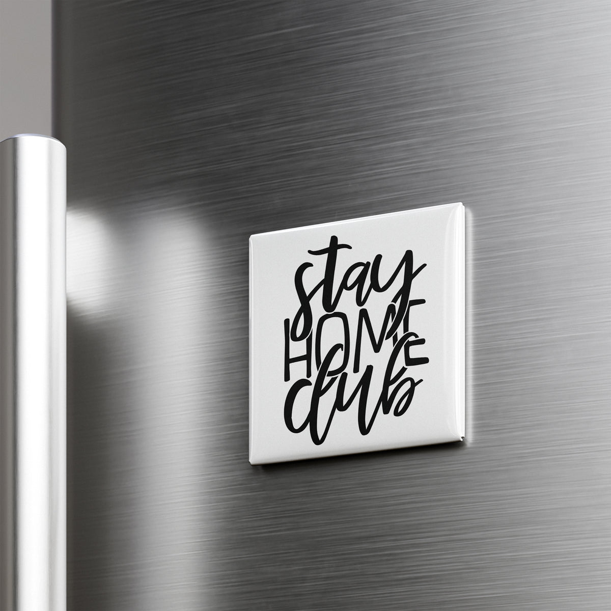 A white square magnet with the text "STAY HOME CLUB" written in a stylized font.