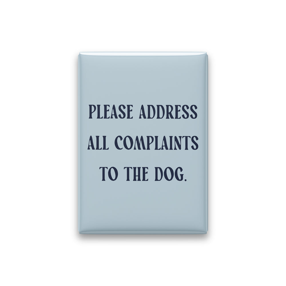 “Please address all complaints to the dog.” powder quote magnet on white