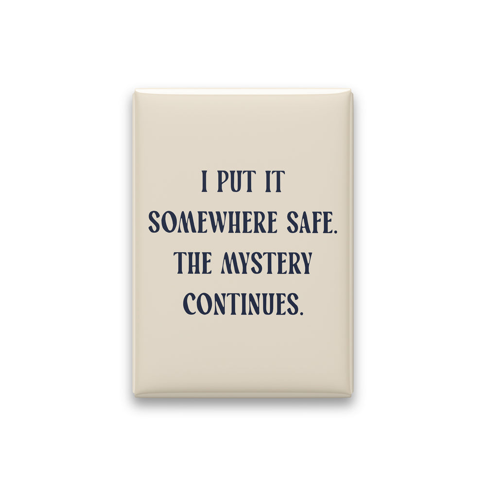 “I put it somewhere safe. The mystery continues.” parchment quote magnet on white
