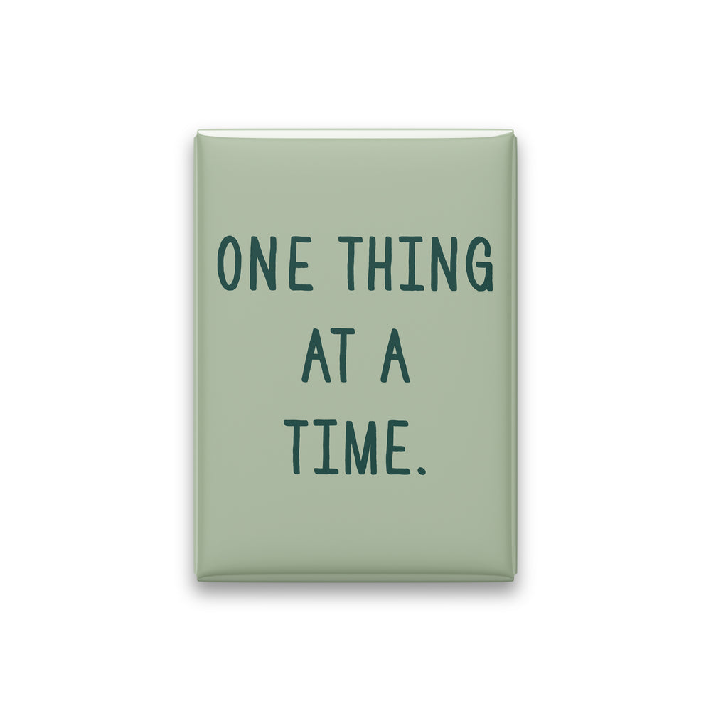 “One thing at a time.” sage quote magnet on white