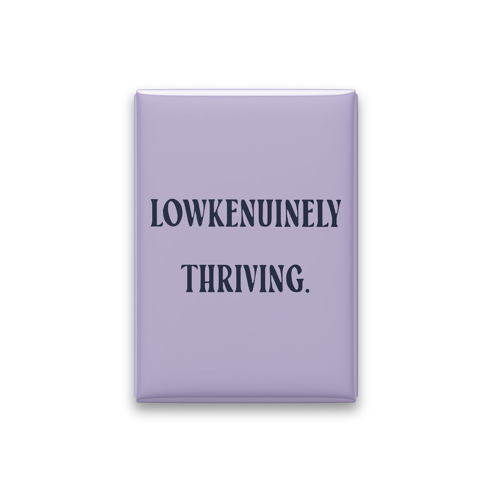 “Lowkenuinely thriving.” lilac quote magnet on white