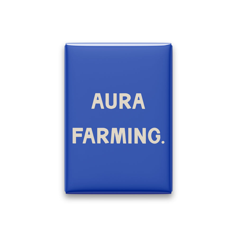 “Aura farming.” cobalt quote magnet on white