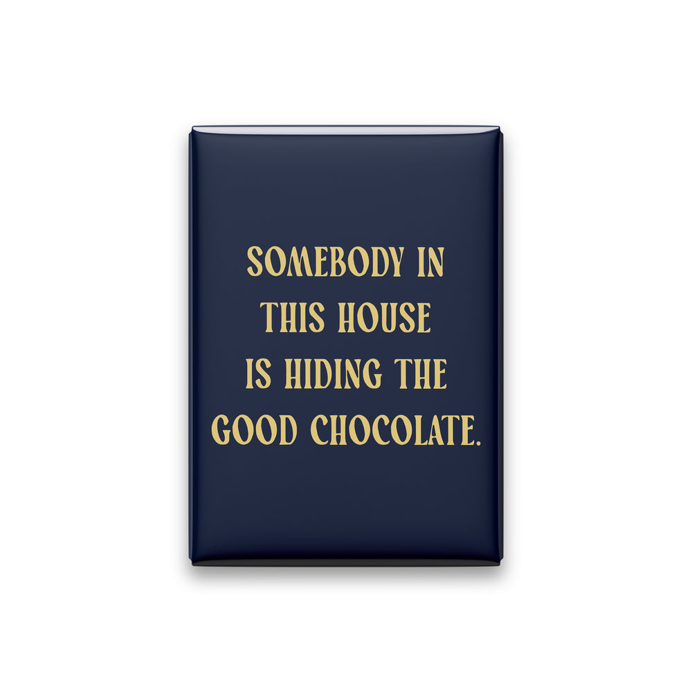 “Somebody in this house is hiding the good chocolate.” midnight quote magnet on white