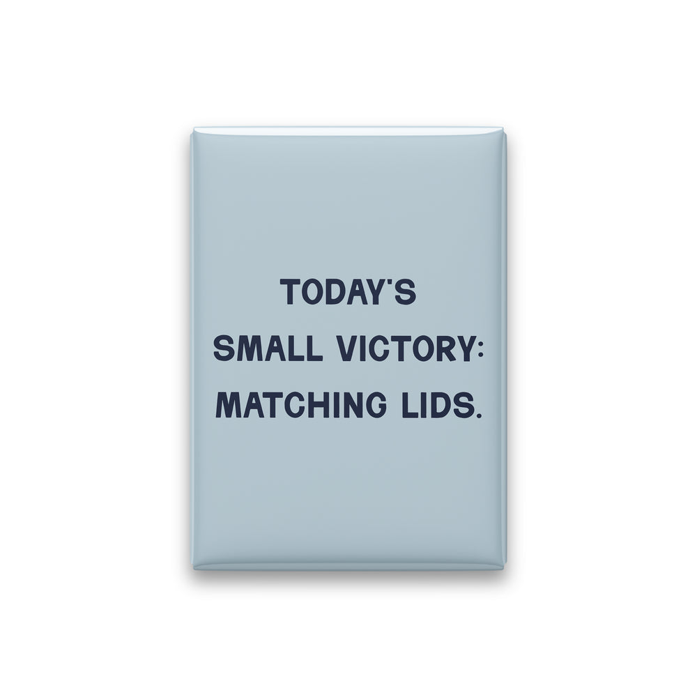 “Today's small victory: matching lids.” powder quote magnet on white
