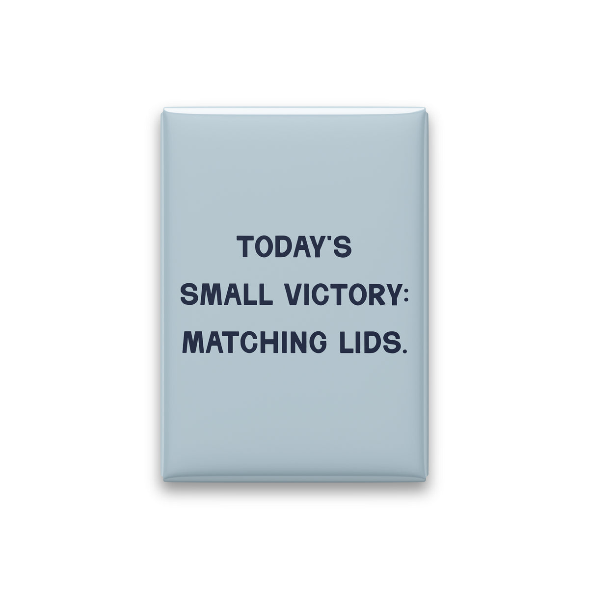 “Today's small victory: matching lids.” powder quote magnet on white