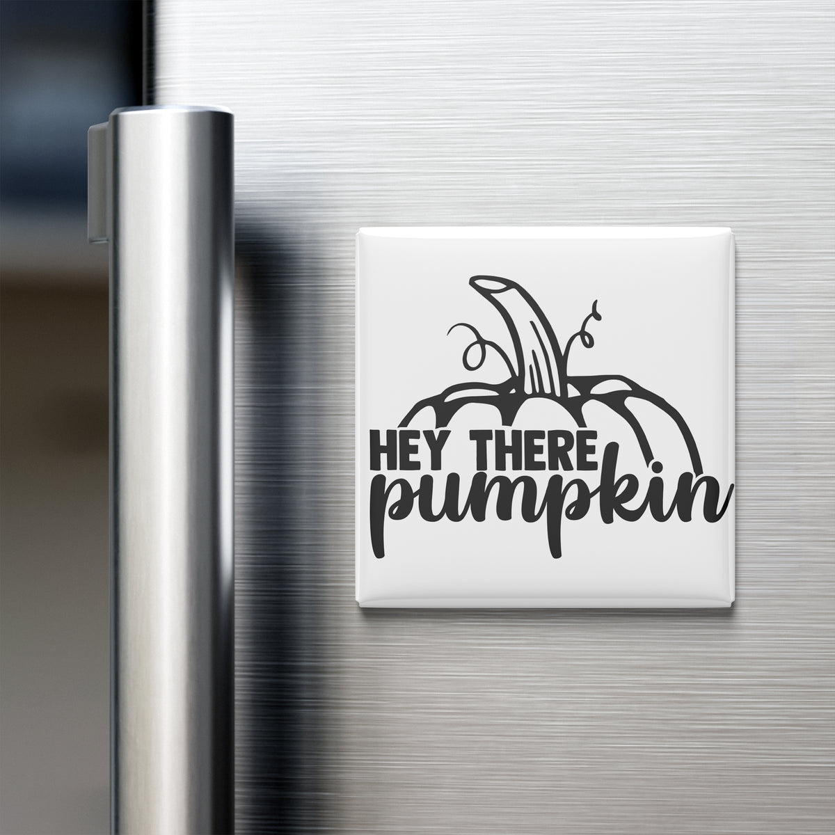 a refrigerator door with a magnet that says "Hey There Pumpkin".