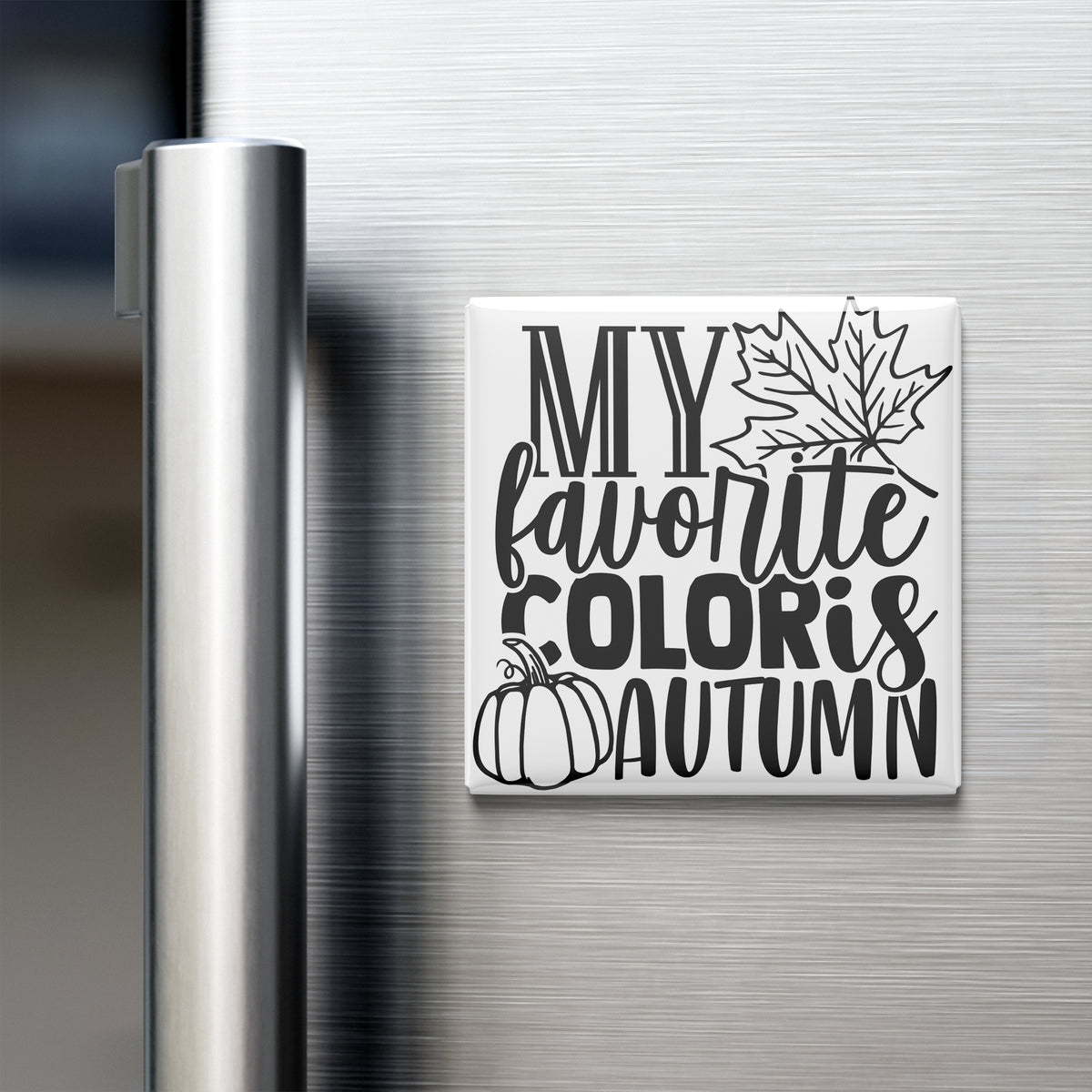 A white refrigerator magnet with black text and graphics that reads "MY FAVORITE COLORIS AUTUMN".