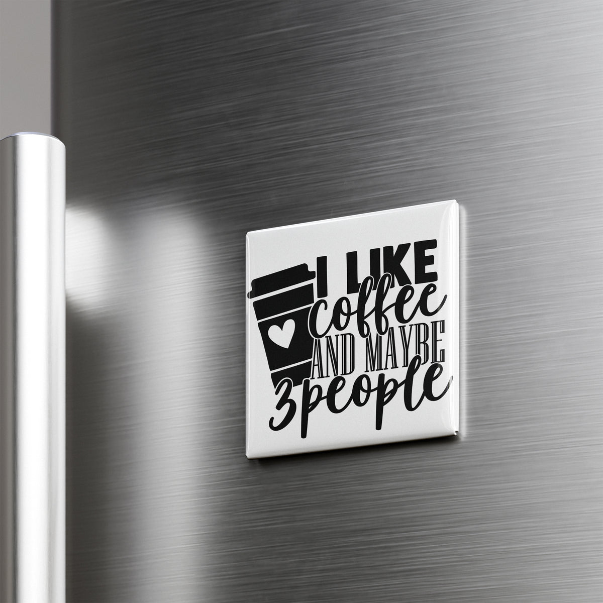A white refrigerator magnet with the text "I LIKE coffee AND maybe 3 people" printed on it.