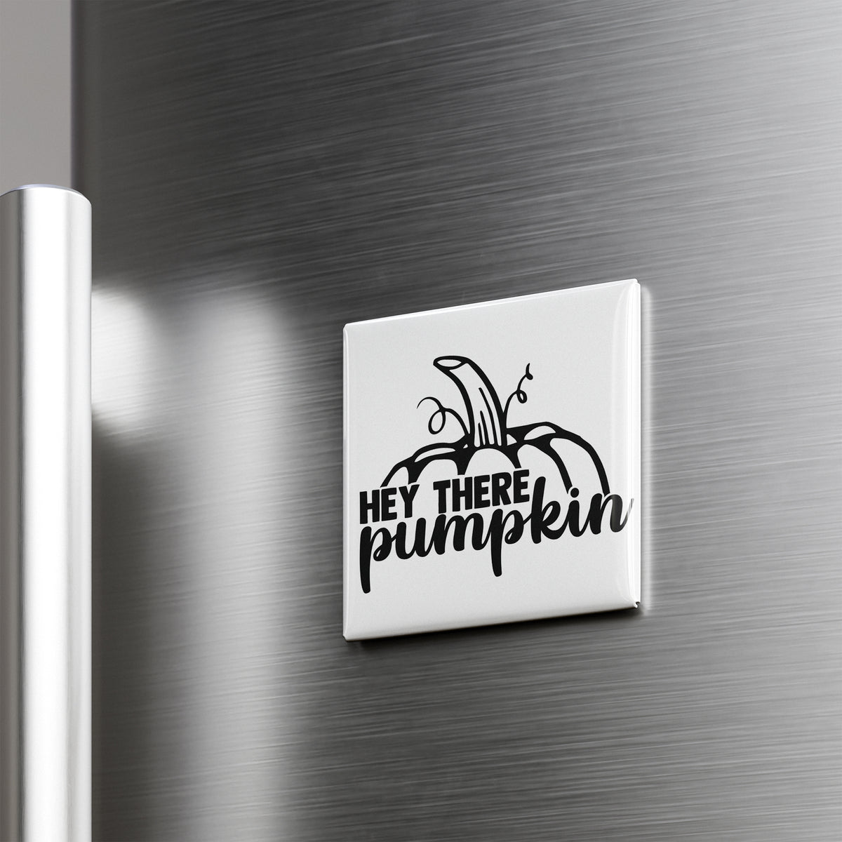 A white refrigerator door with a black and white sticker that says "HEY THERE PUMPKIN"