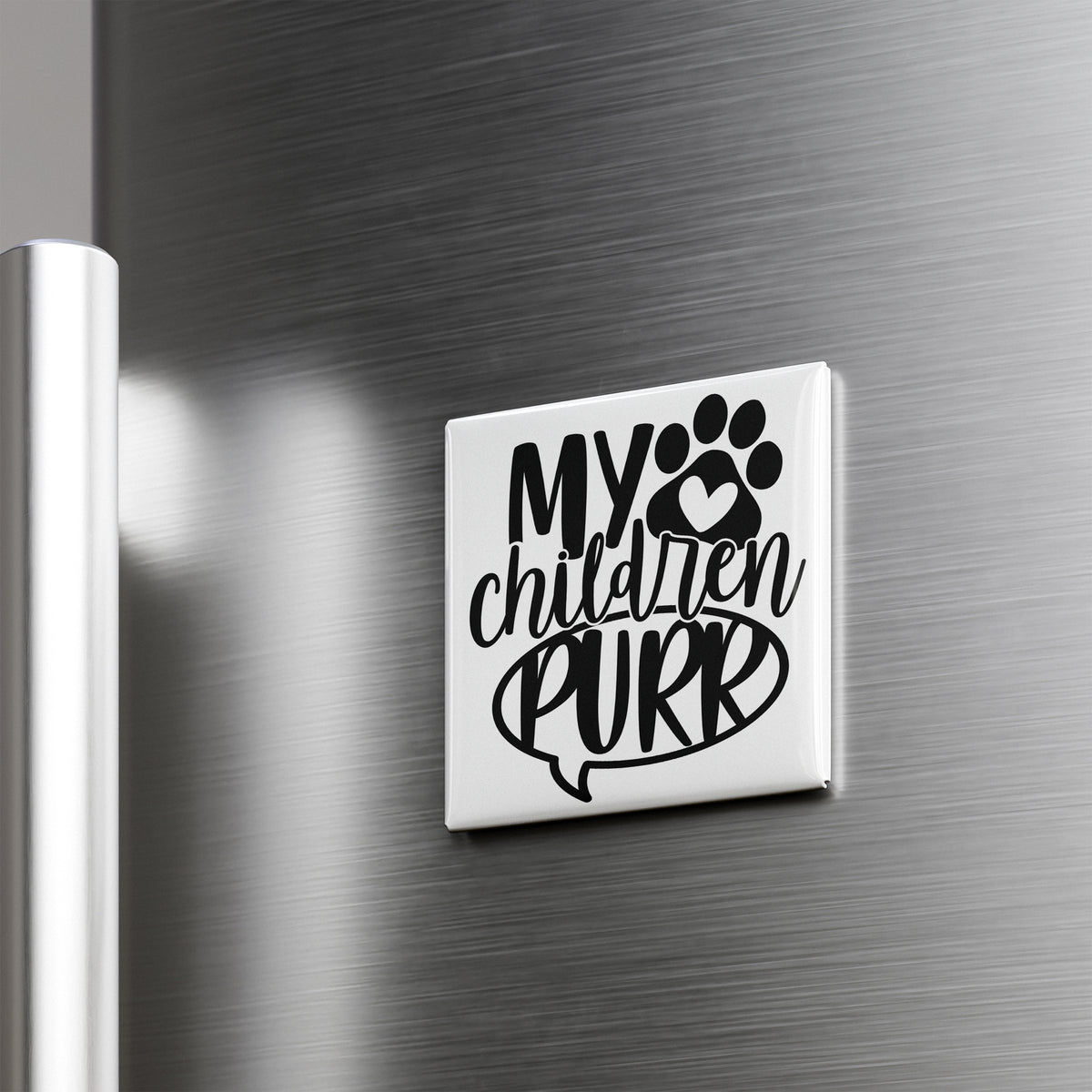 A refrigerator door with a sticker or decal that says "My children purr" along with a paw print symbol.