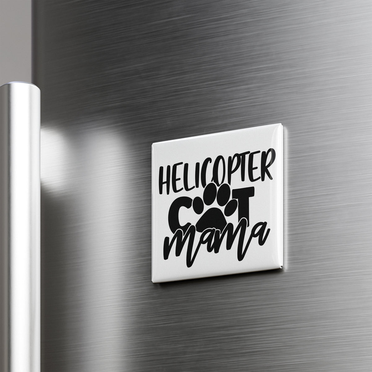 A refrigerator door with a sticker that says "HELICOPTER COT MAMA" in a stylized font.