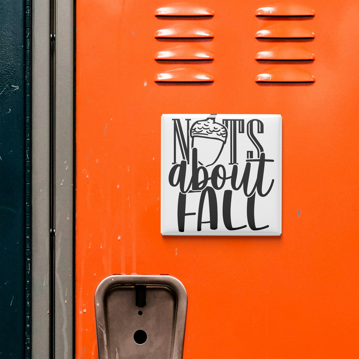 a close-up of an orange surface with a white sign that reads "NOTS ABOUT FALL".