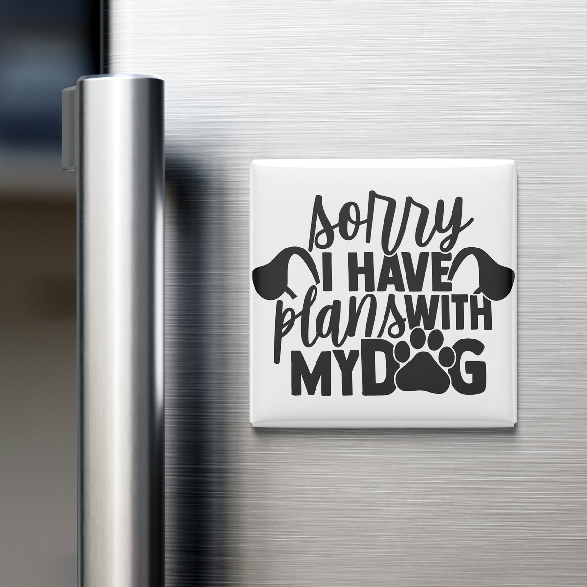 A refrigerator door with a humorous text magnet that reads "Sorry I HAVE plans with my dog".