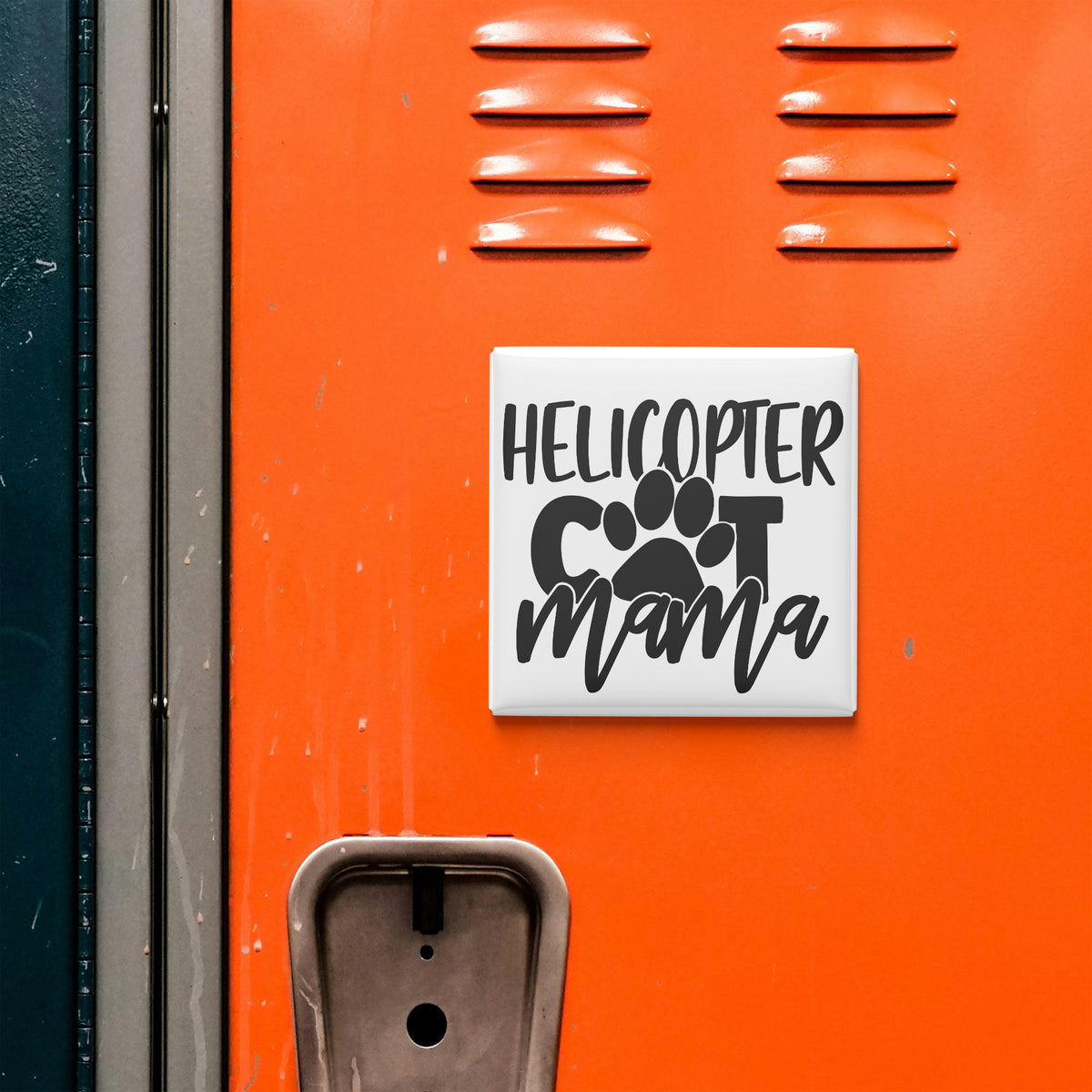 a sticker with the text "HELICOPTER COT MAMA" on an orange surface, which appears to be a locker or a storage unit.