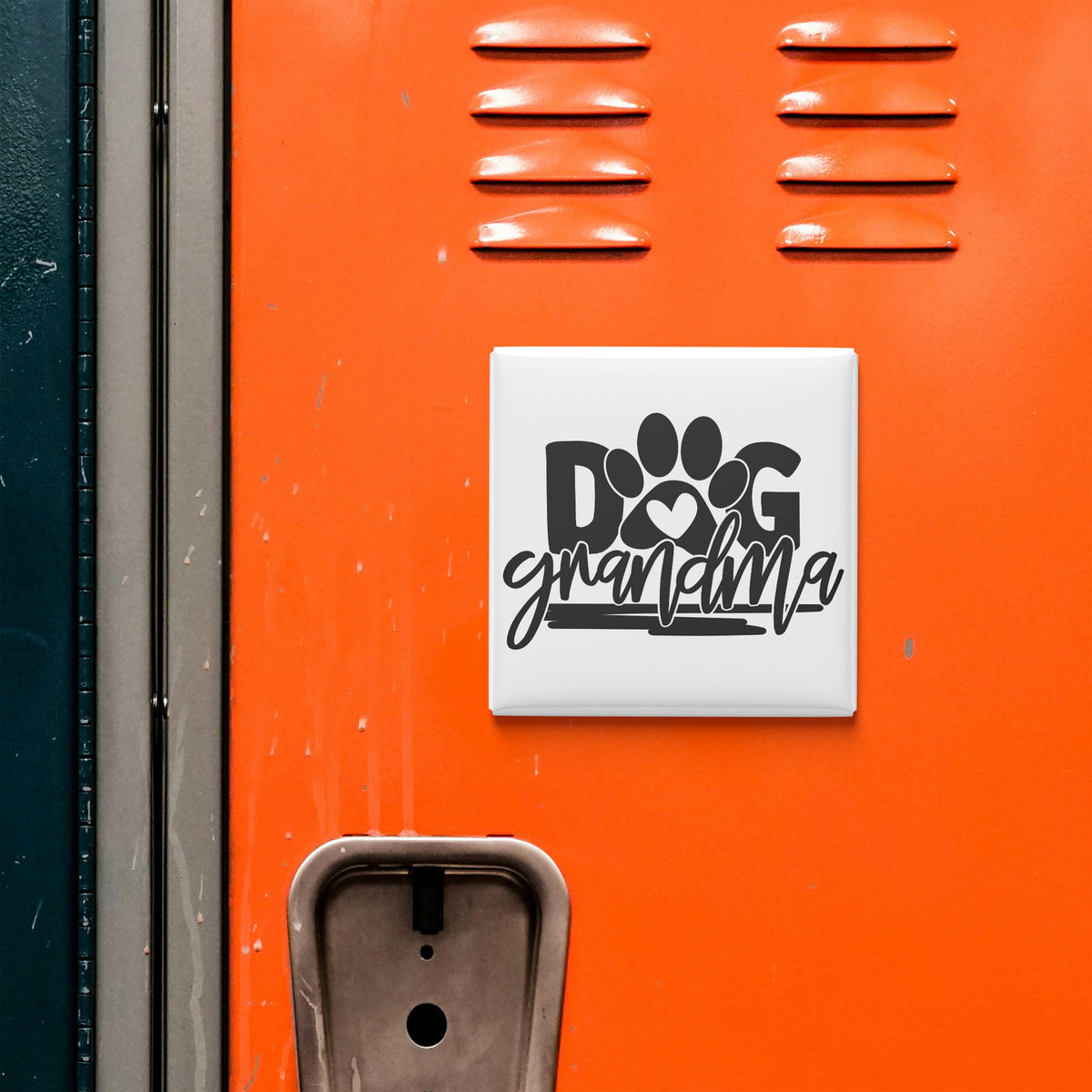 a close-up of an orange locker with a sign that says "DOG grandmothera" on it.