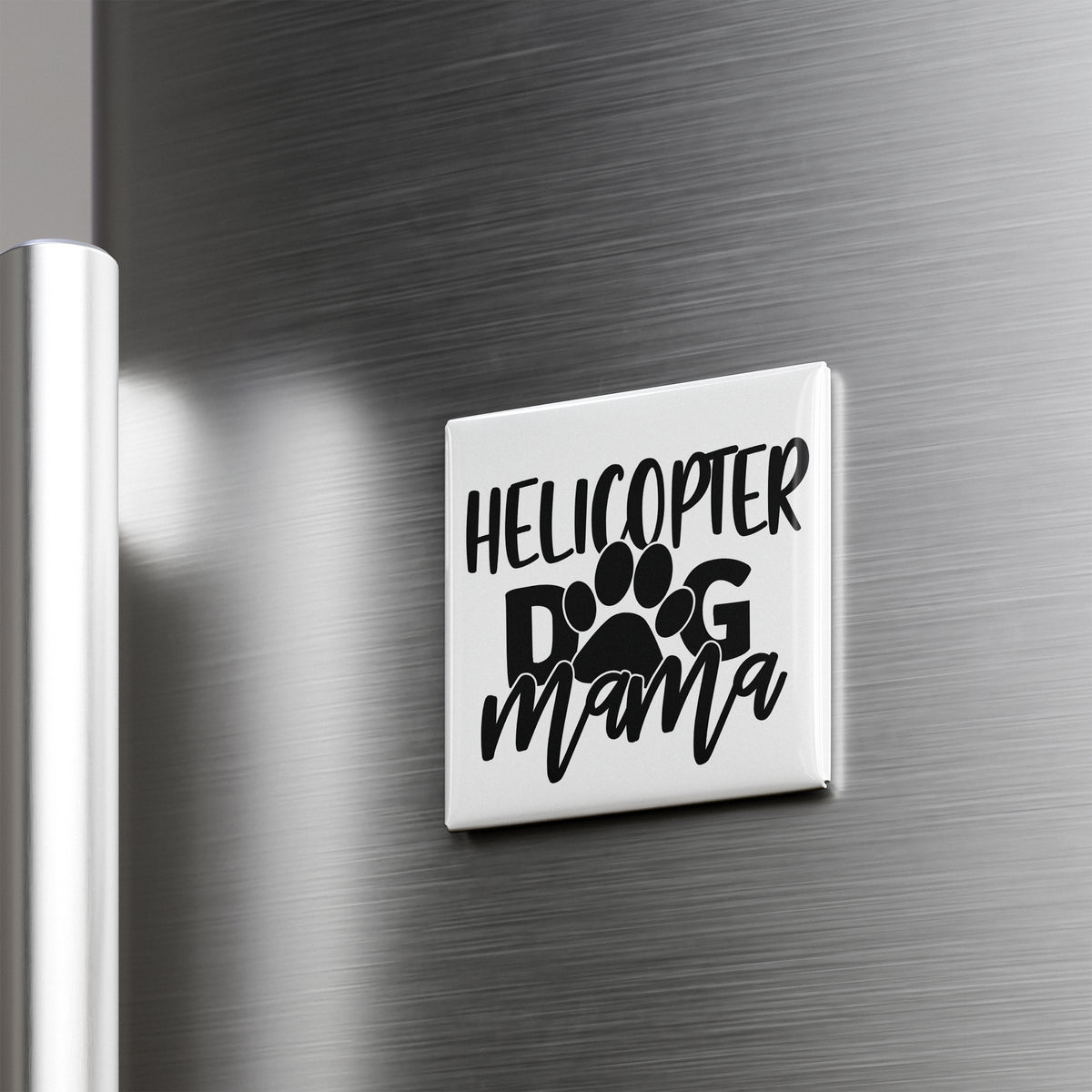 A refrigerator door with a sticker that says "HELICOPTER DOG MAMA" in black text.