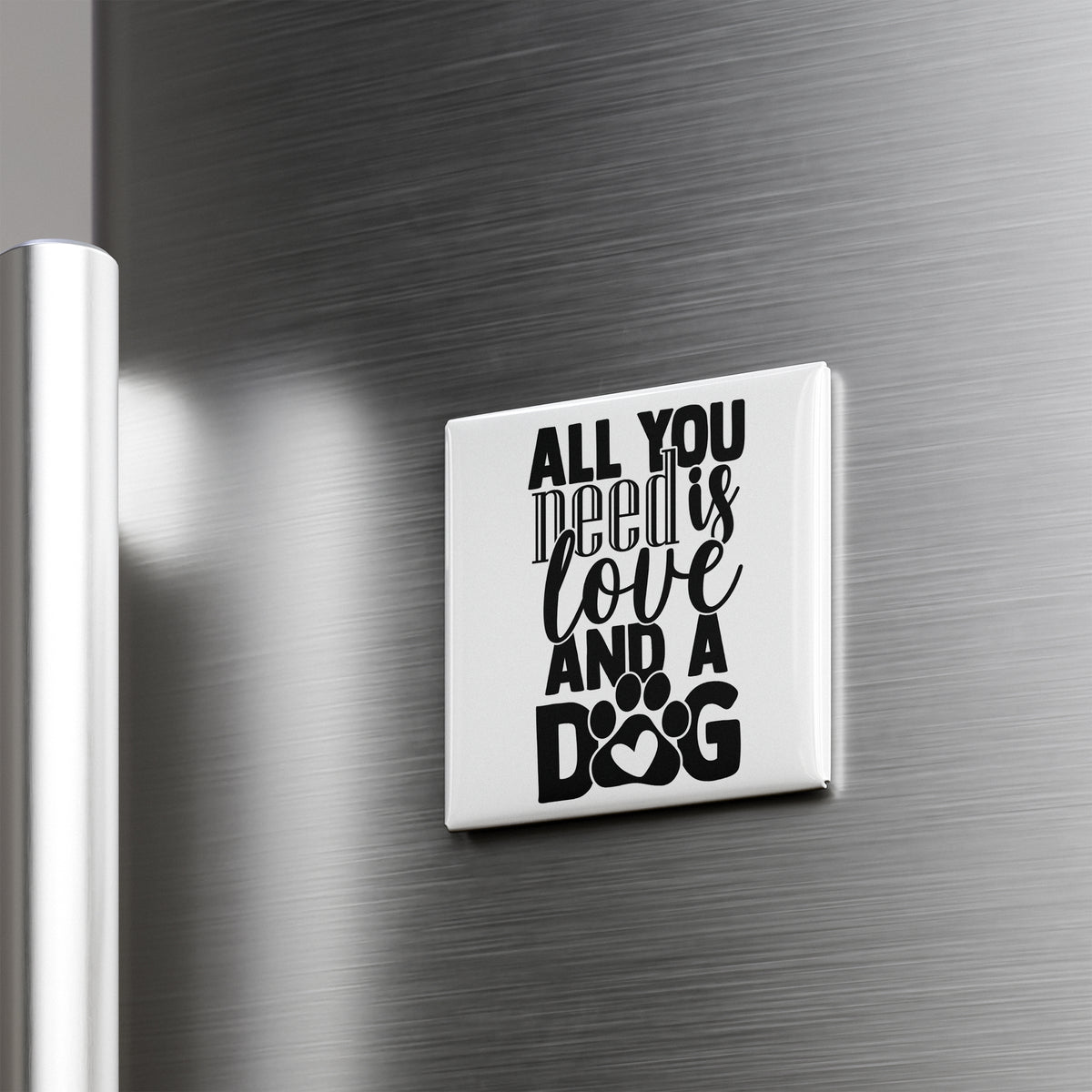 A white refrigerator magnet with the text "ALL YOU NEED IS LOVE AND A DOG" printed on it.
