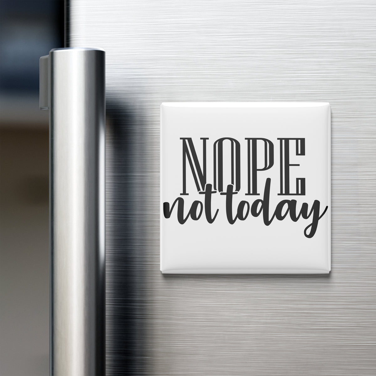 A white refrigerator magnet with the text "NOPE not today" printed on it.