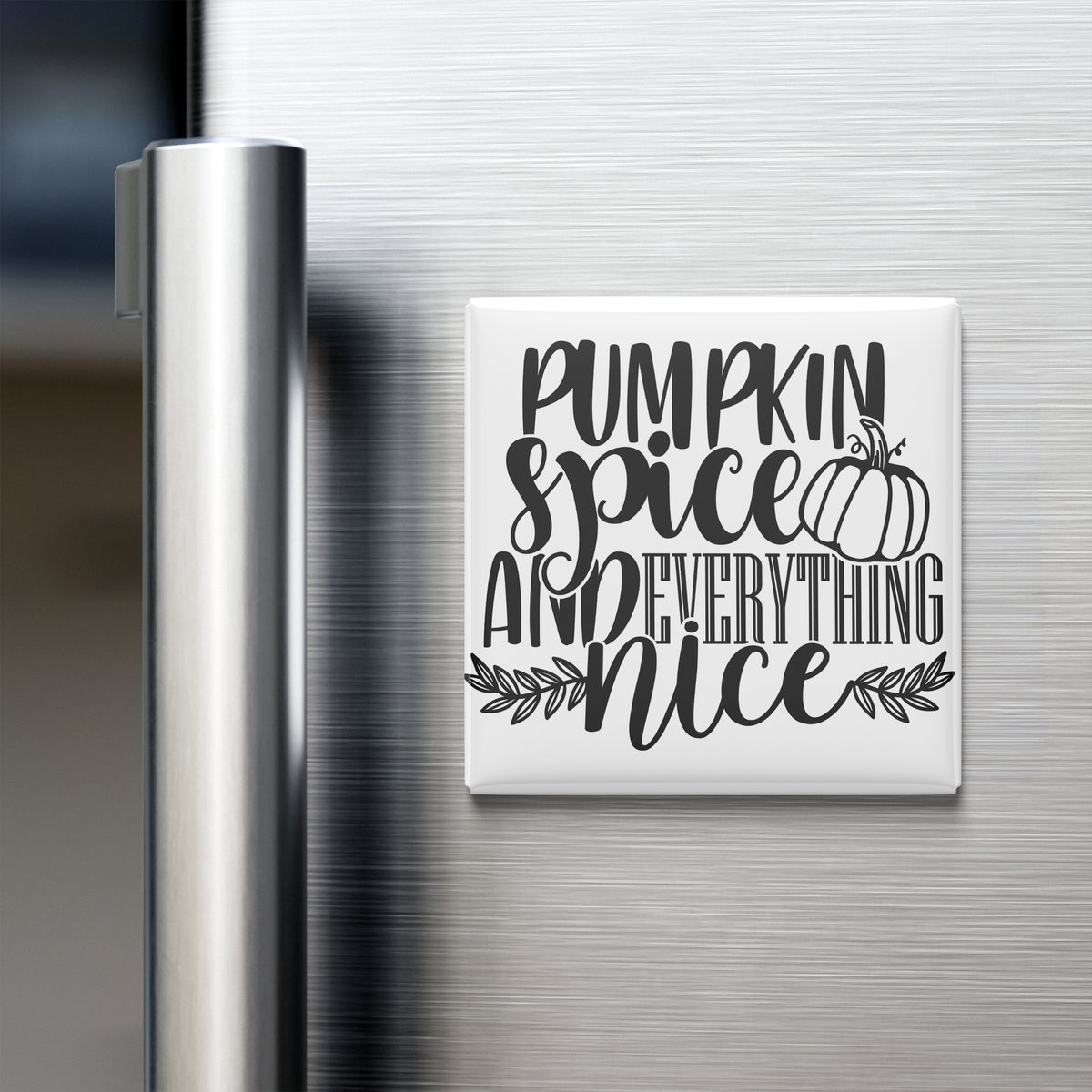 A white refrigerator magnet with the text "Pumpkin spice and everything nice" written on it.