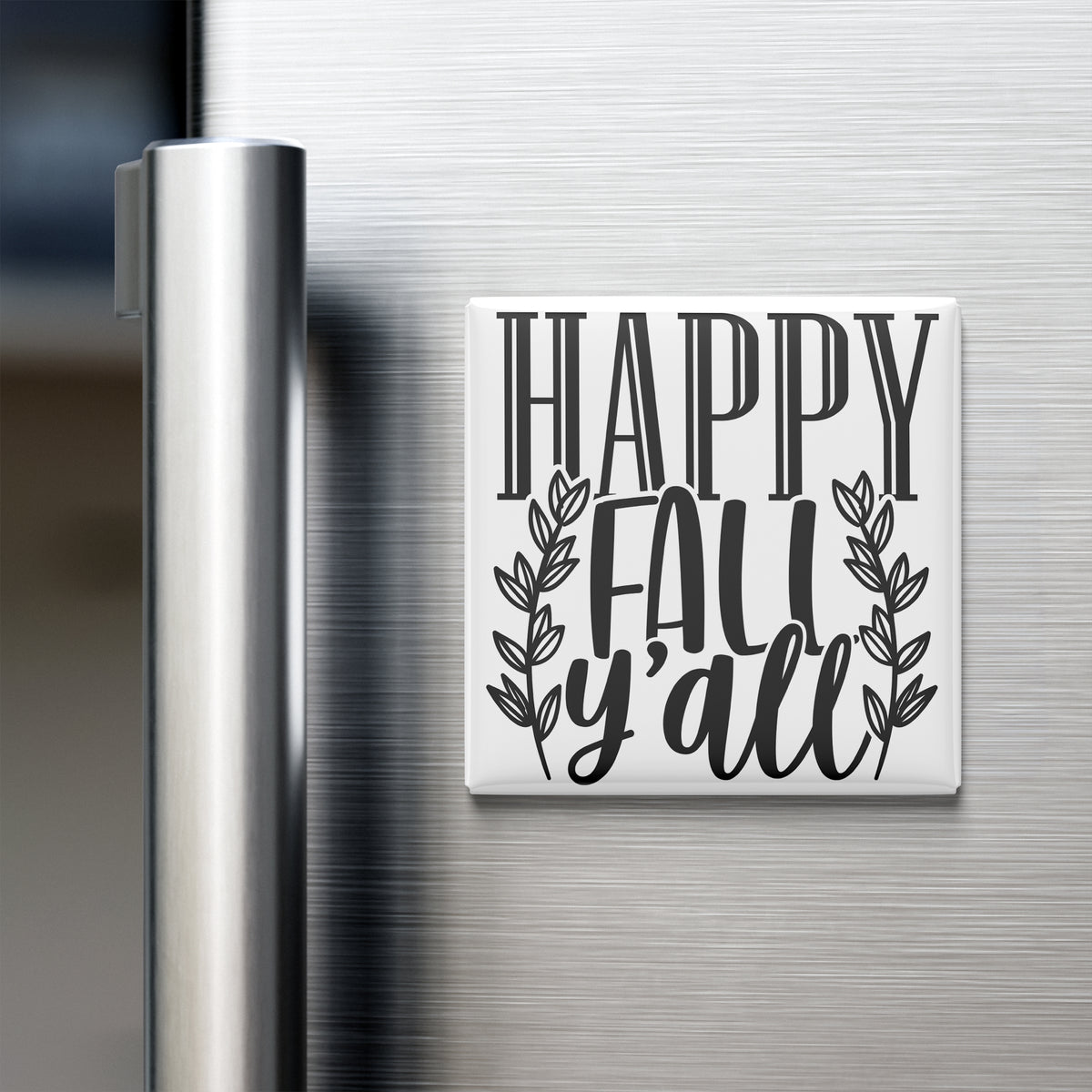 A white refrigerator magnet with the text "HAPPY FALL Y'ALL" printed on it.