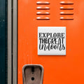 a bright orange surface with a sign that says "EXPLORE THE GREAT Indoors" in bold black letters.