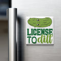 A refrigerator door with a humorous license plate magnet that says "License to dill".
