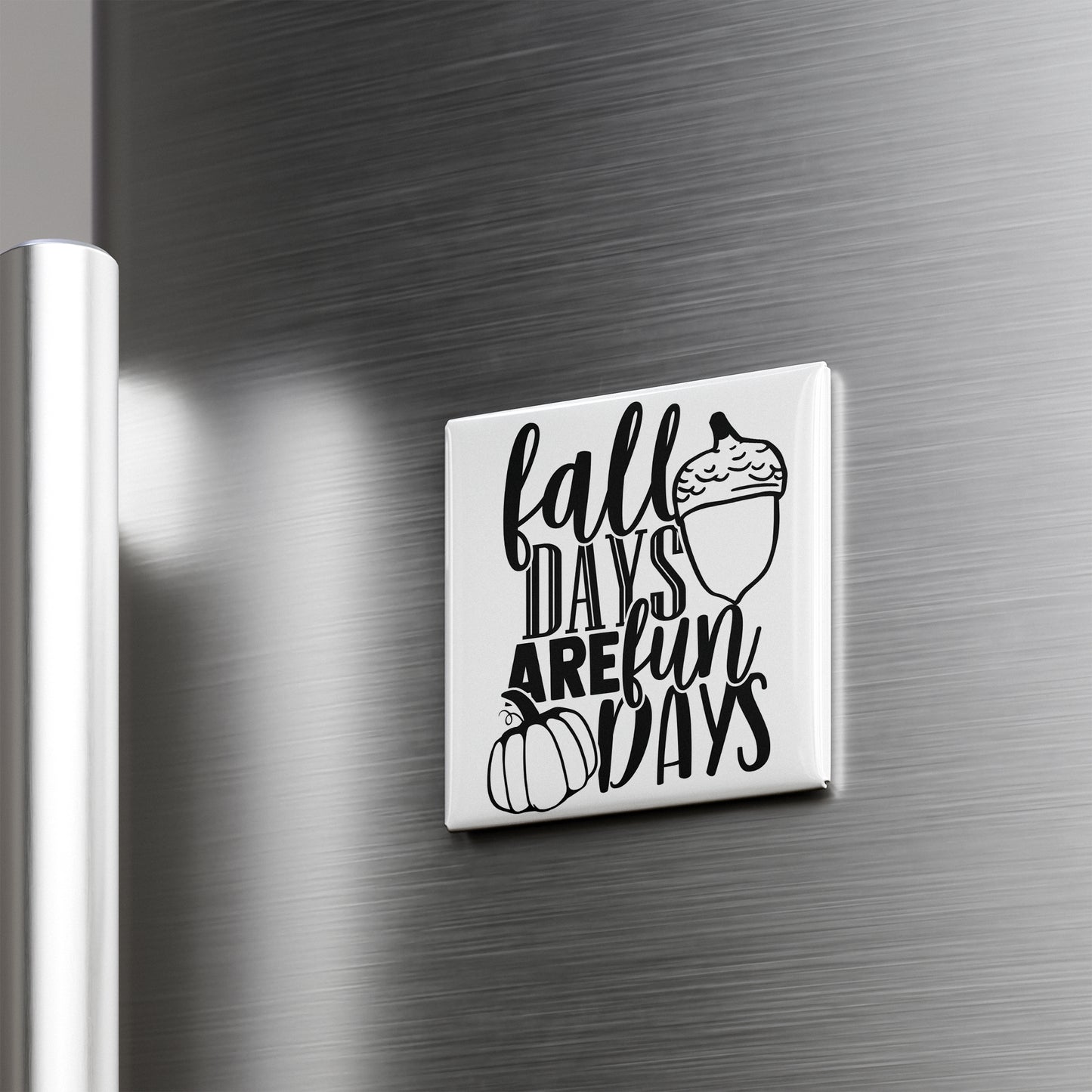 A white refrigerator door with a black and white graphic and text that says "fall days are fun days".