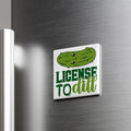A refrigerator door with a humorous license plate sticker that says "LICENSE TO DILL".