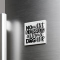 a white square magnet with the text "NO outfit is complete without dog hair" printed on it.