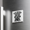A humorous fridge magnet with the text "I'M NOT LIKE A REGULAR MOM I'M A DOG MAMA" printed on it.