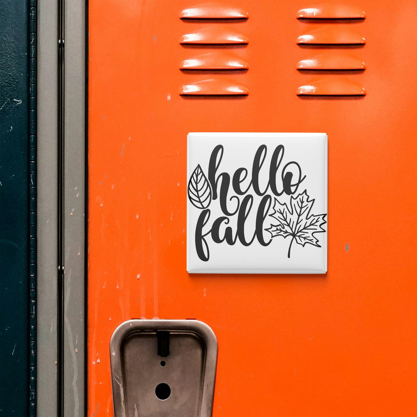 a vibrant orange wall with a white sign that reads "Hello fall" and a leaf graphic.